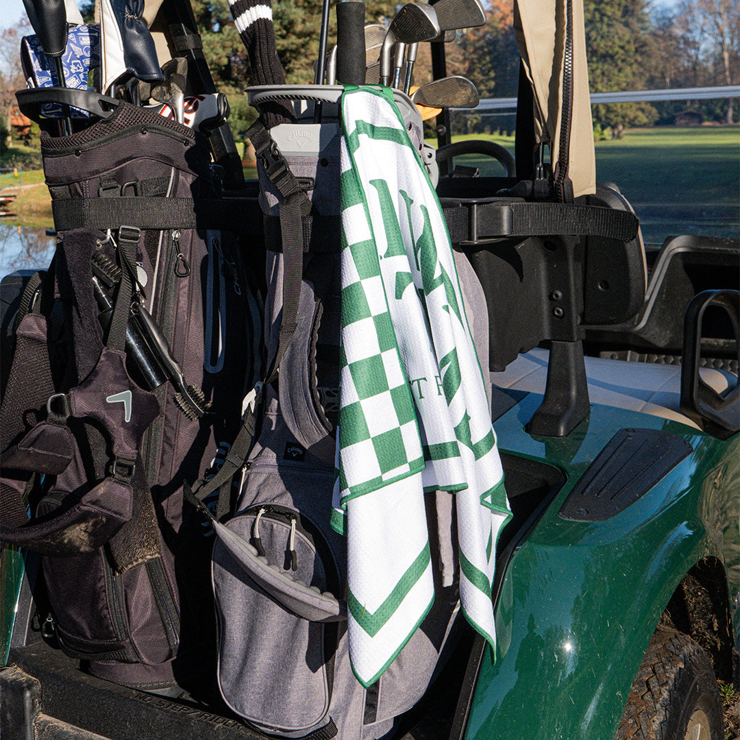 Three Putt Round It's Always Tee Time Tour Towel with vibrant golf-themed design, soft fabric, and embroidered logo.