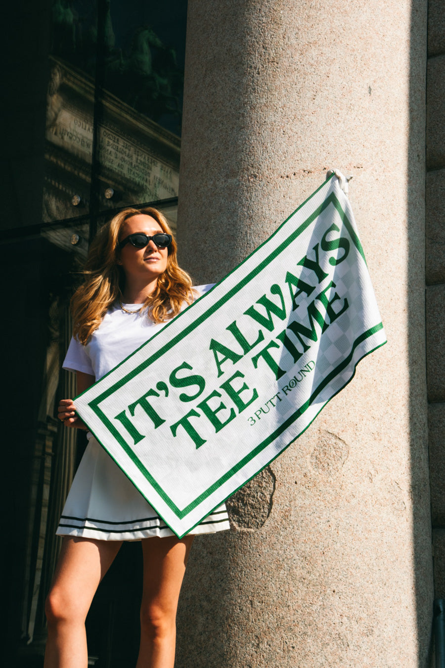 Soft cotton golf towel with "It's Always Tee Time" print by Three Putt Round, featuring a vibrant design and hanging loop.